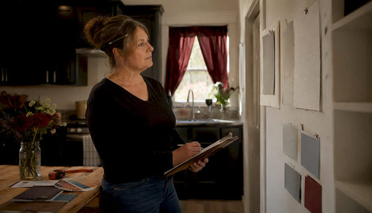 Homeowner evaluating drywall finishing samples
