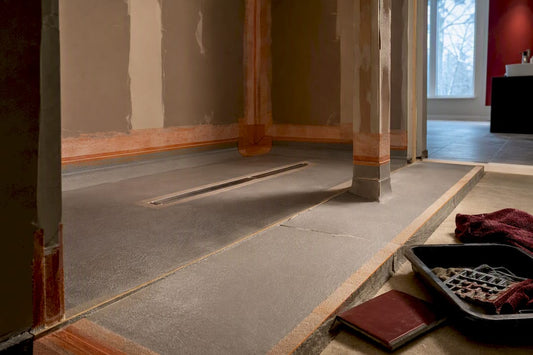 Unfinished curbless shower waterproofing assembly